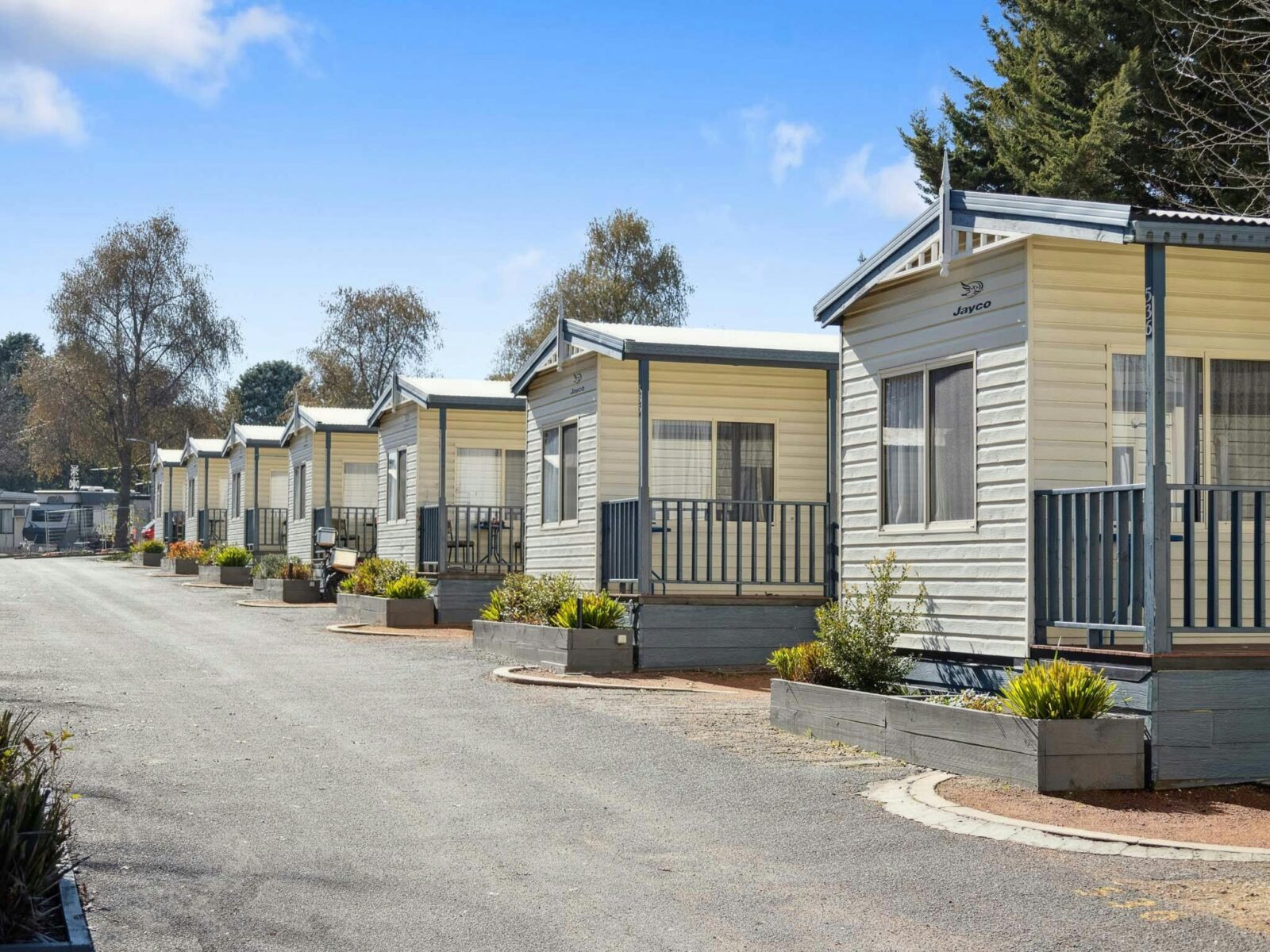 Row of well-maintained cabins at Southside Village, ideal for a peaceful and convenient stay.