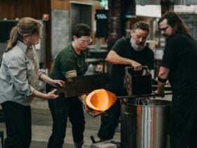 Four artists cooling the pipes in the Glassowrks Hotshop