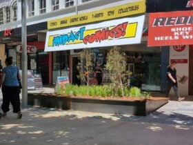 View of Impact Comics shopfront from Garema Place