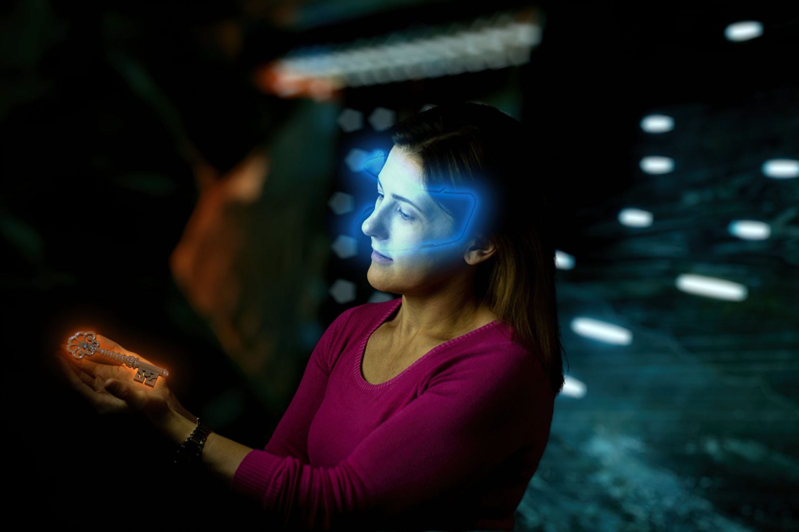 Lady with glowing VR headset looking at glowing key in escape room
