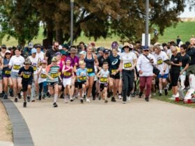 Group of people running and participating in the fun run