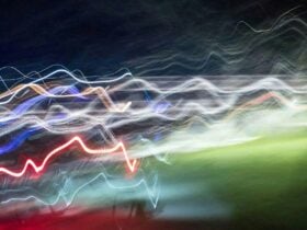 a long exposure image of moving lights