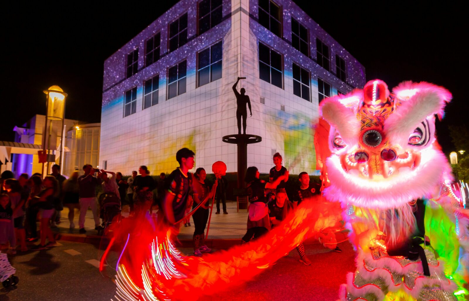 Questacon illuminated with Chines dragon dancers