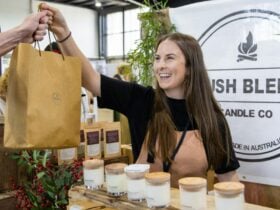 Bush Blend Candle Co handing bag to a customer