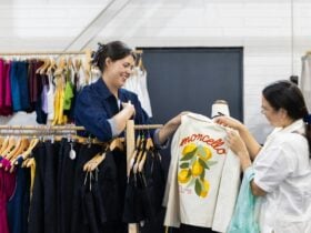 Al ElÃ© showing a customer a jacket