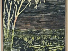 A print of a view into a tree filled valley,