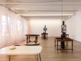 Contemporary art exhibition consist of sculptural objects which look like tables