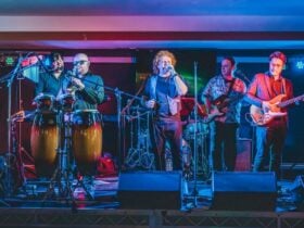 Picture Book - Simply Red tribute band performing. Singer, percussion, guitar, bass.