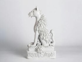 Ceramic sculpture of a dog like creature