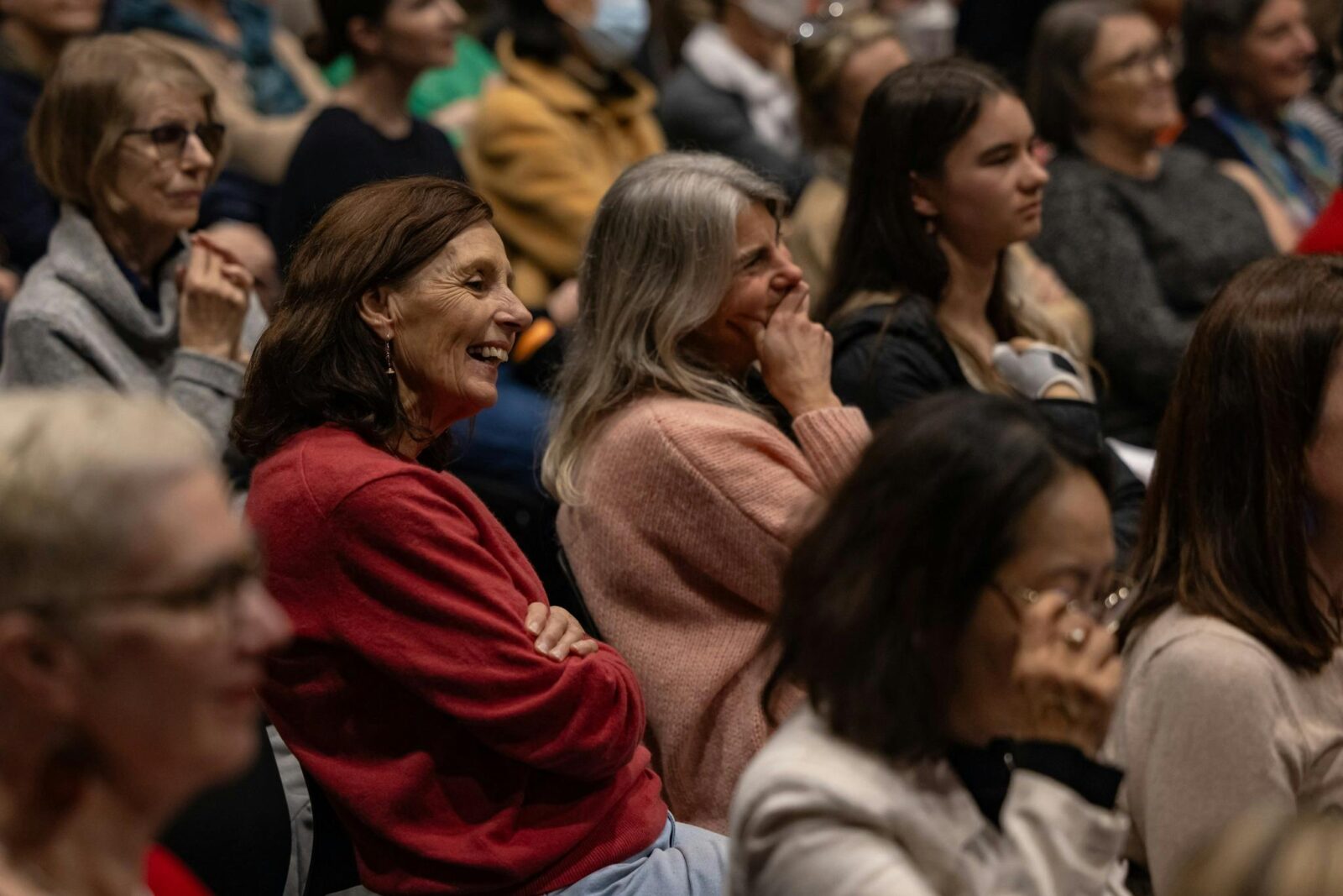 Crowd of people sitting in a theatre