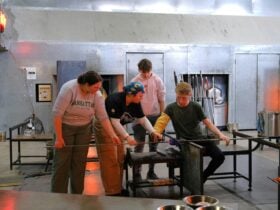Participants and teacher during glassblowing class