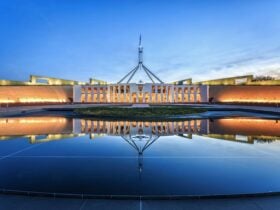 Photo of Australian Parliament House in the evening.
