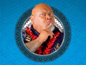Man posing with finger on lips saying âShuuush Your Moufâ under the name âTofigaâ on blue background