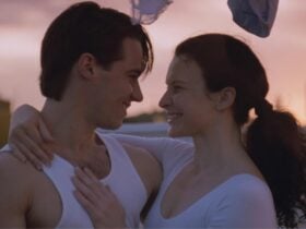 Woman and man embracing and smiling towards each other