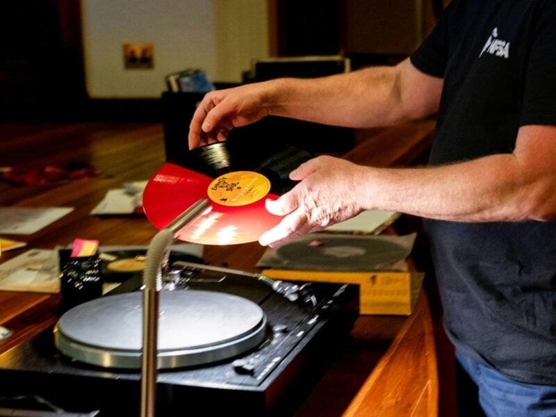 Close up of man preparing to play vinyl