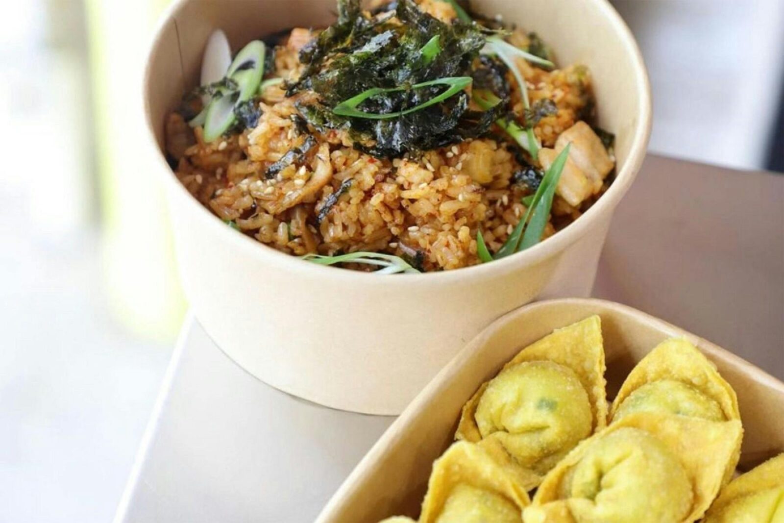 Fried rice and wontons in takeaway containers