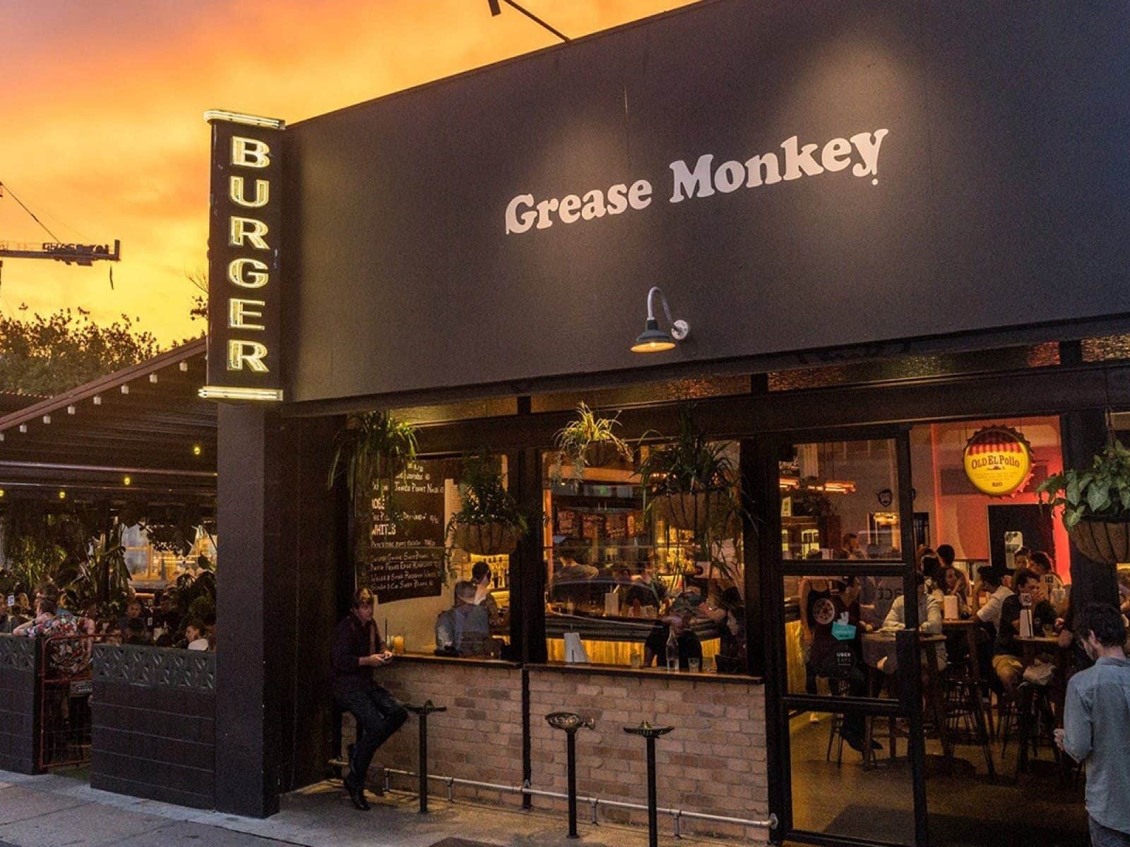 Dark building exterior in front of a sunset