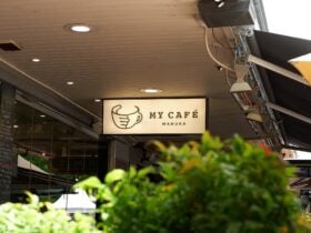 Backlit sign saying 'My Cafe Manuka'