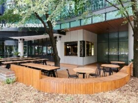 Outdoor cafe setting with wooden furniture