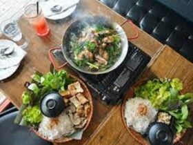 Asian dishes steaming laid out on a table