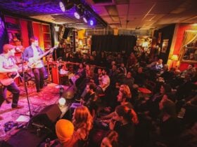 Band onstage at Smith's Alternative in front of an audience