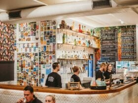 Group of people working behind a bar