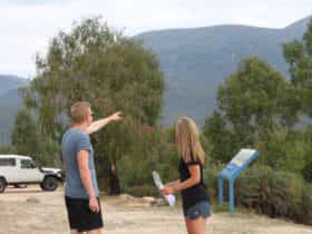 Man pointing towards mountain at Tidbinbilla Nature Reserve
