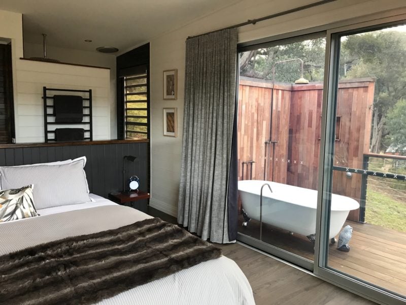 King size bed, outdoor shower and bath.