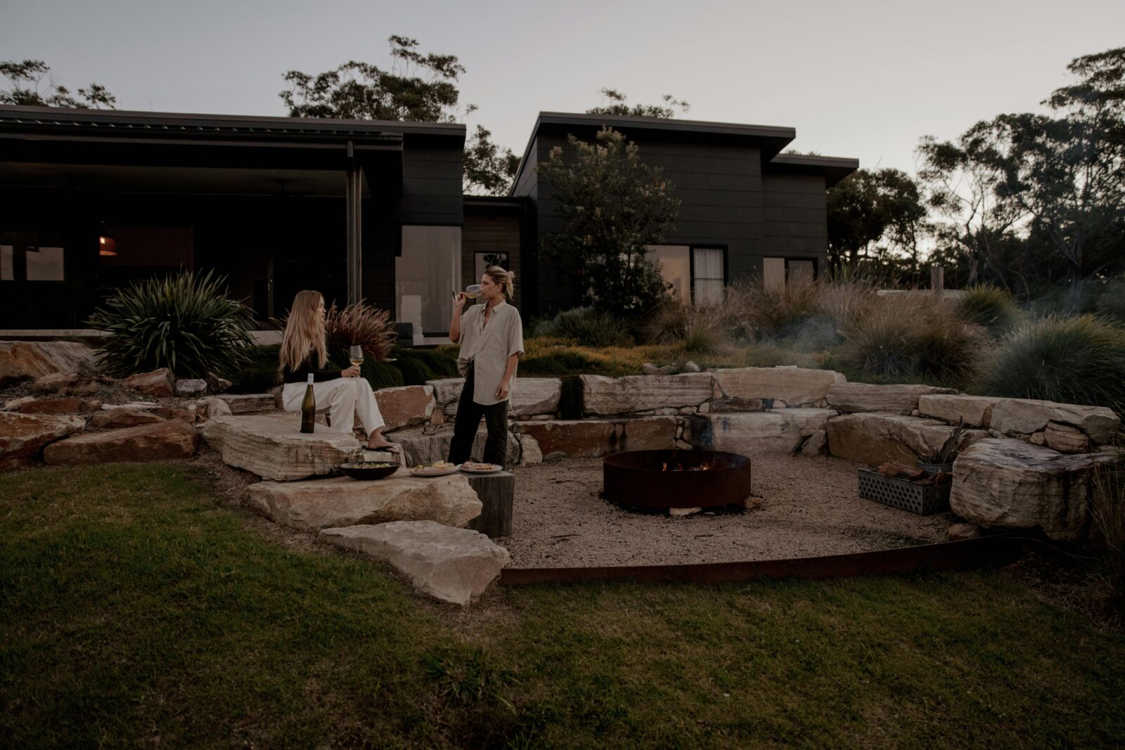 outdoor sunken fire pit and house at Boketto Brooms Head