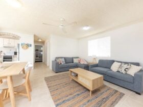 Lounge and dining with lounges, dining setting and ceiling fan