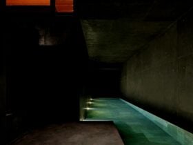 Deep blue of the pool mirroring nature, giving the sense of swimming in a waterhole