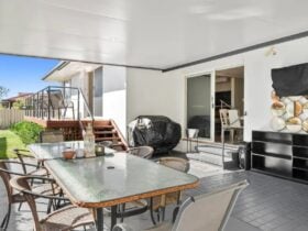 Undercover outdoor dining area with BBQ & TV