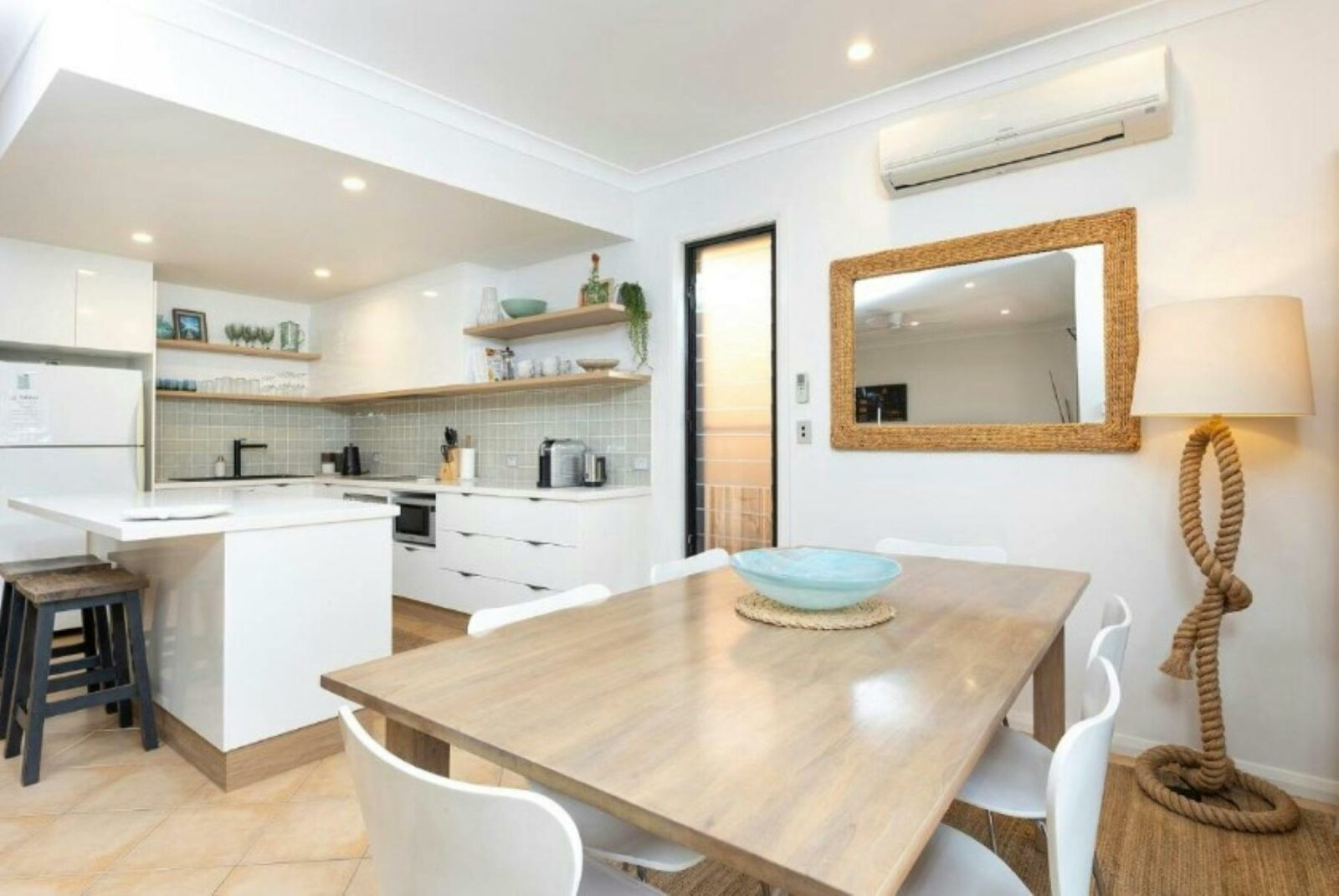 Kitchen and dining with air-conditioning and coastal decor