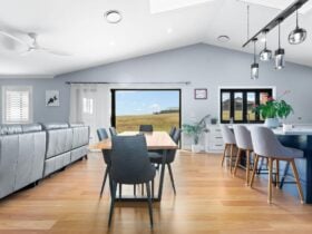 Living area with lounge, dining and large kitchen