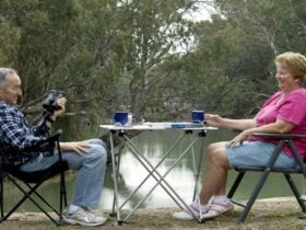 Two grey nomad travellers in Mamanga campground. Photo: Boris Hlavica/NSW Government