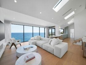 Spacious lounge with natural light and ocean views.