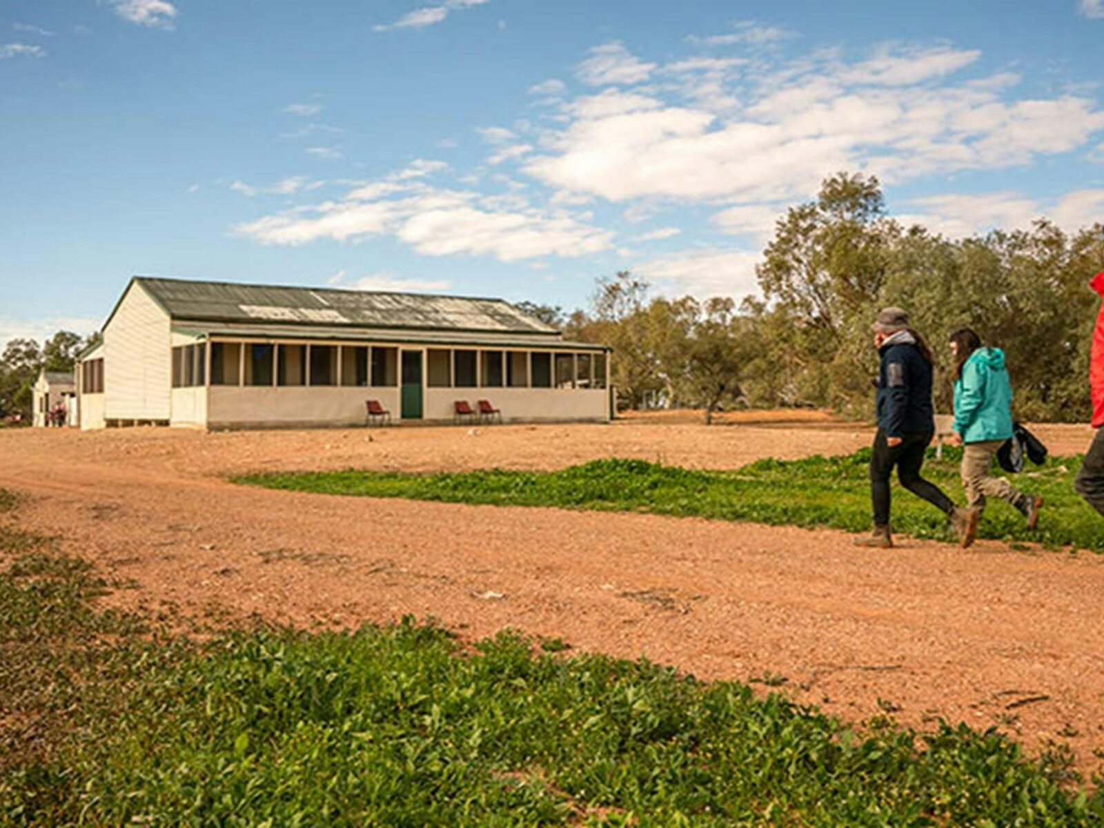 Group of friends walking outside Mount Wood Shearers Quarters. Photo: John Spencer/DPIE