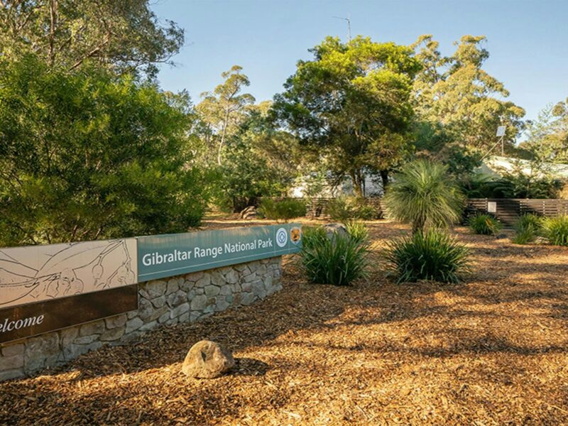 Park sign on entry to Mulligans campground. Photo: Robert John Spencer © DCCEEW