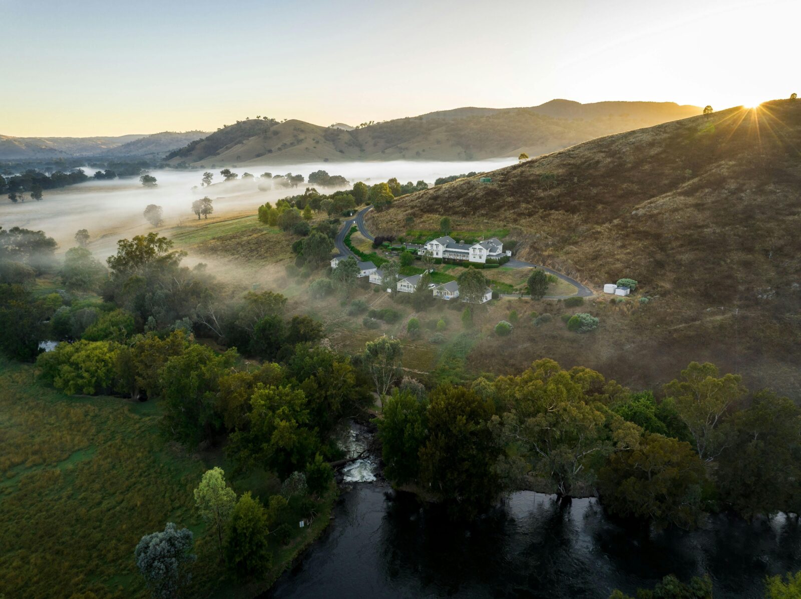 Cottages on the hill with the sun rising