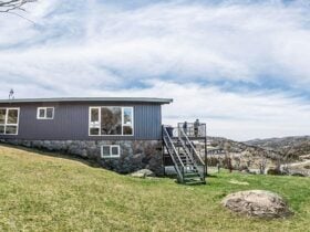 Exterior view of Numbananga Lodge in summer, Smiggin Holes, Kosciuszko National Park. Photo: Robert