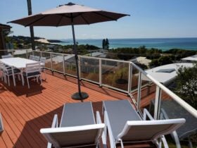 Deck with dining setting and loungers