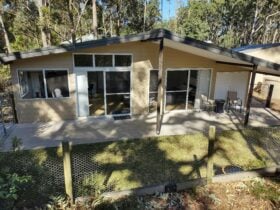 Large sliding glass doors enable easy access in and out of the cottage