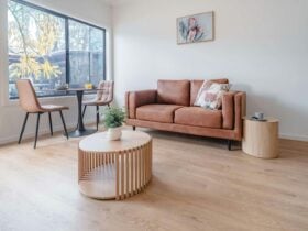 Living area with leather sofa, dining room