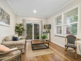 Great space for dinner or movie night, with doors to the outdoor area.
