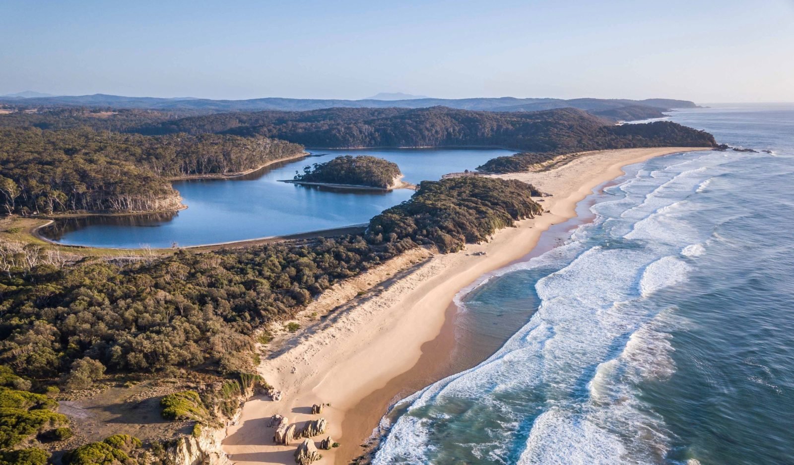 Walk to a stunning beach from Tanja lagoon camp