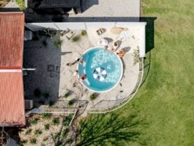 IMage of aerial view of pool area. Guests are gatherered around the plunge pool. Pool donut seen