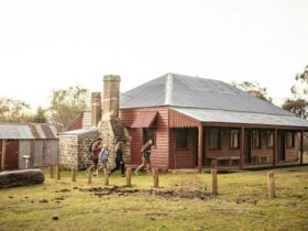 Visitors walking to The Pines Cottage, Kosciuszko National Park. Photo: Rob Mulally/DPIE