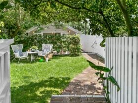 Enter from the street , front garden with chairs and table to relax