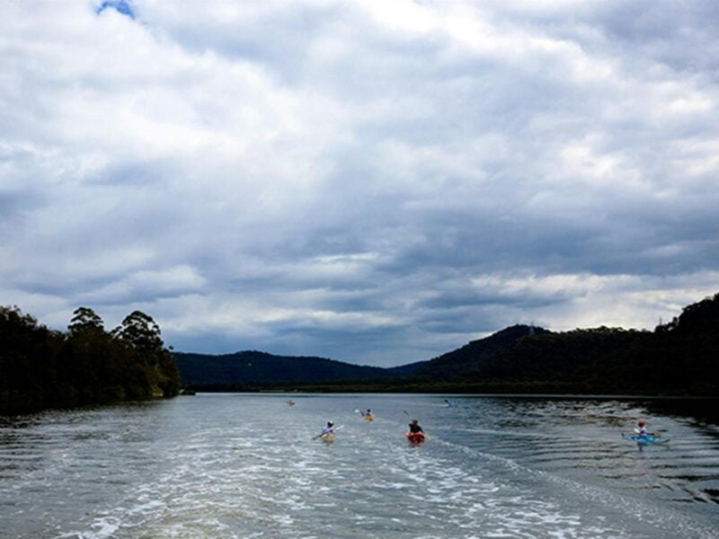 A group of kayakers on the Hawkesbury River on a cloudy day. Photo: Rosie Nicolai/DPIE.