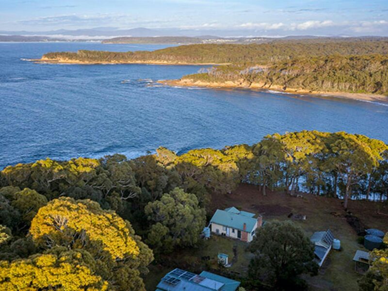Aerial view of Yellow Rock Beach House, the ocean and headlands. Photo: John Spencer © DPIE